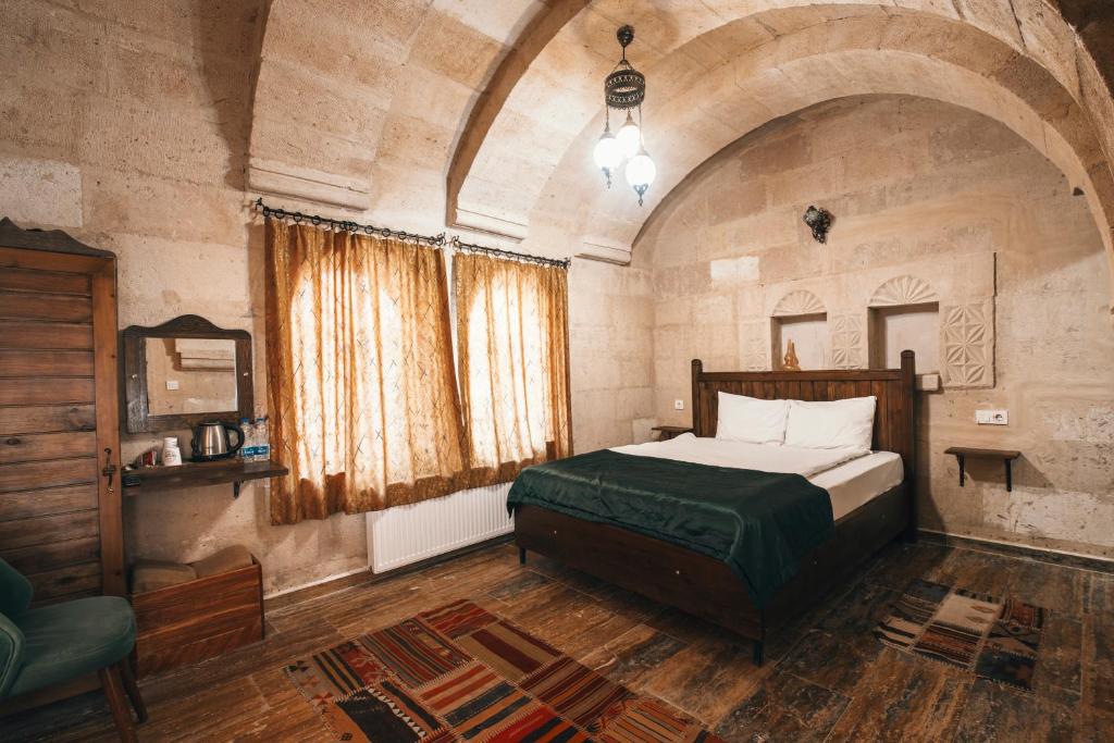 Postel nebo postele na pokoji v ubytování Sierra Cave Göreme Cappadocia