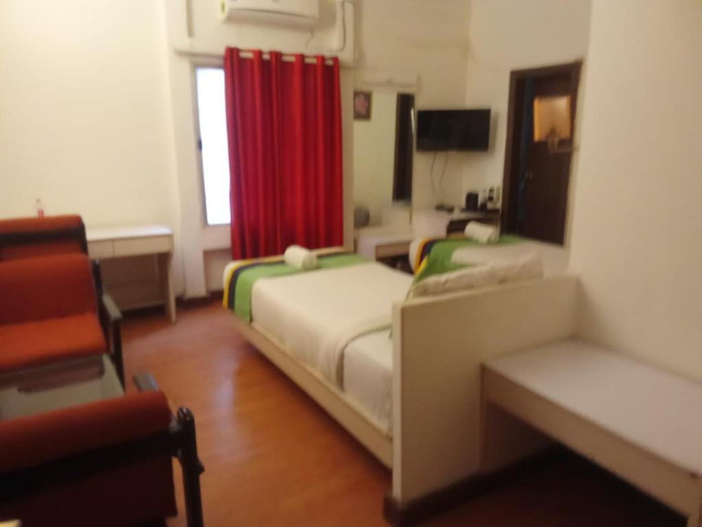 Postel nebo postele na pokoji v ubytování Hotel Crown