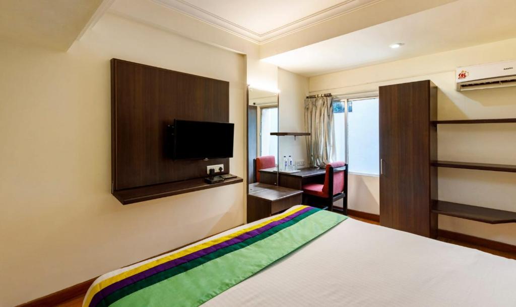 Postel nebo postele na pokoji v ubytování Hotel Crown
