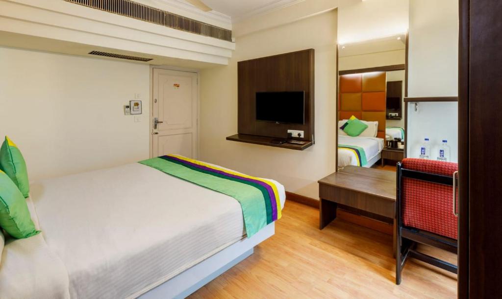 Postel nebo postele na pokoji v ubytování Hotel Crown