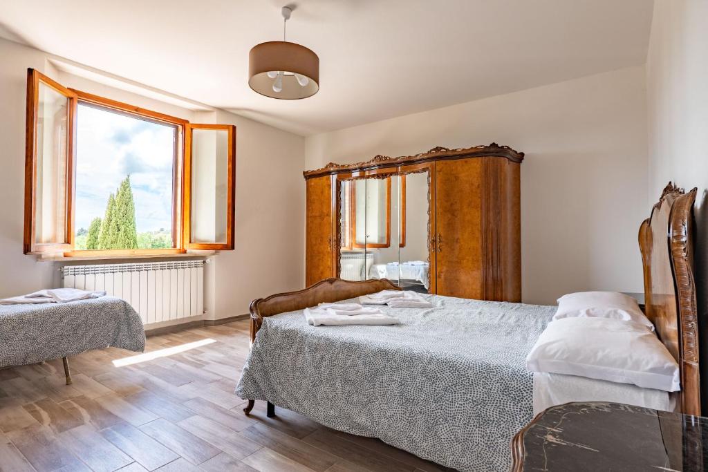 Łóżko lub łóżka w pokoju w obiekcie Casalchino-Fattoria La Torre
