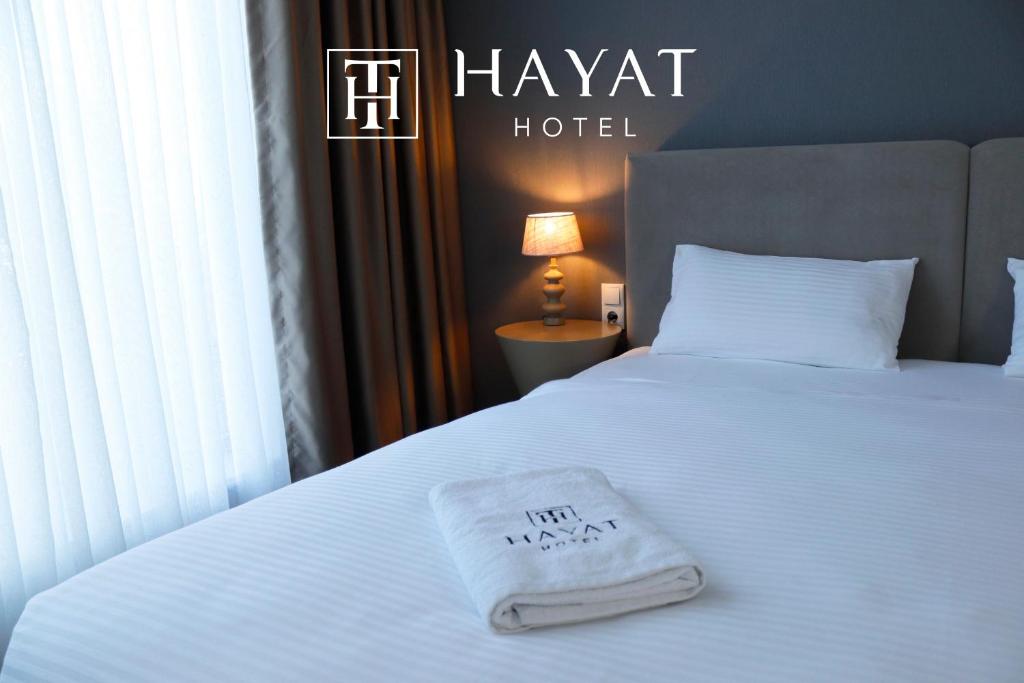 Postel nebo postele na pokoji v ubytování Hayat Sky Hotel Rust