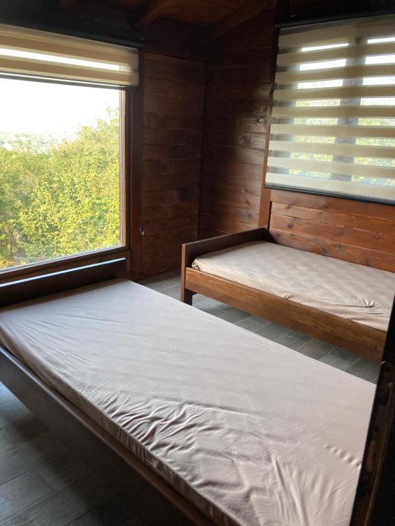 Postel nebo postele na pokoji v ubytování Brvnara Leska