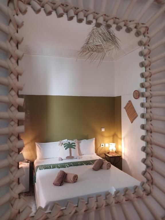 Postel nebo postele na pokoji v ubytování Riad Dantella