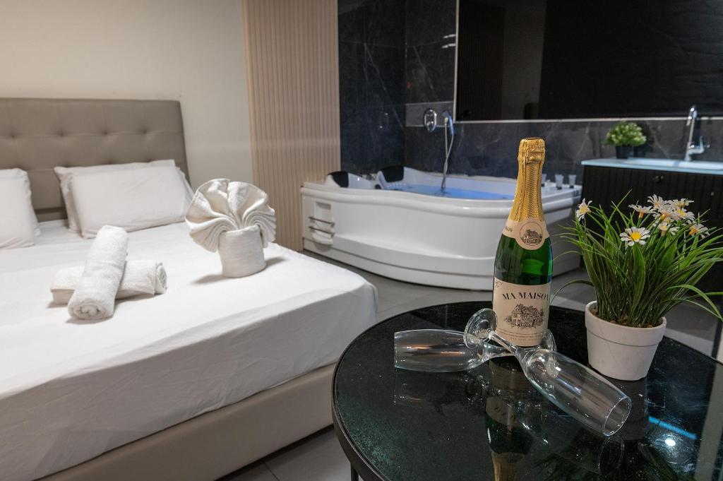 Postel nebo postele na pokoji v ubytování Lago Suites Hotel