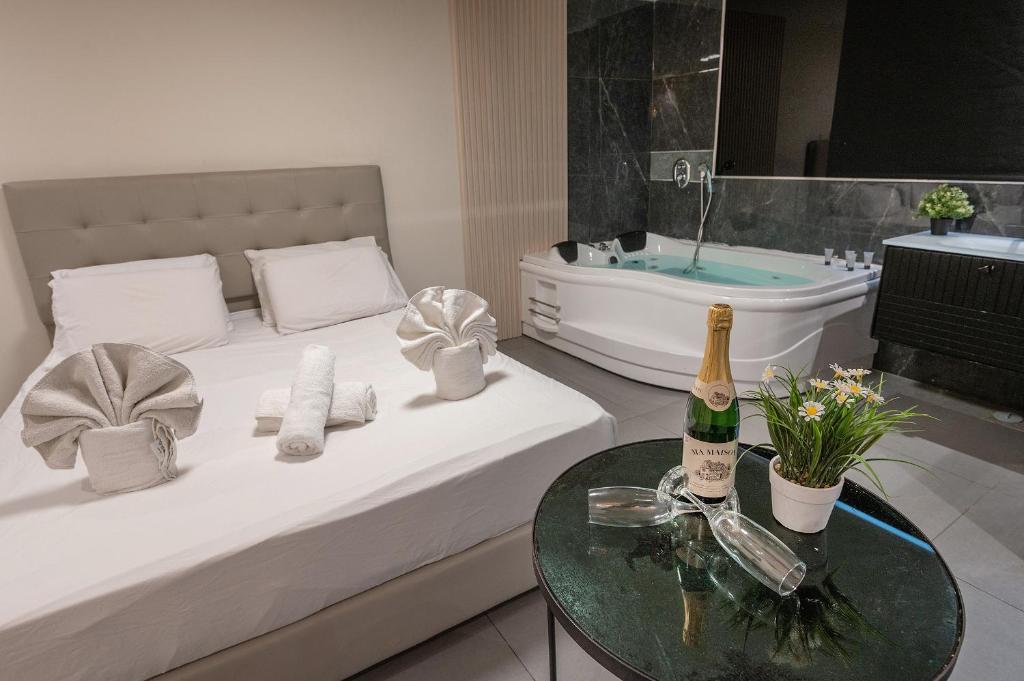 Postel nebo postele na pokoji v ubytování Lago Suites Hotel