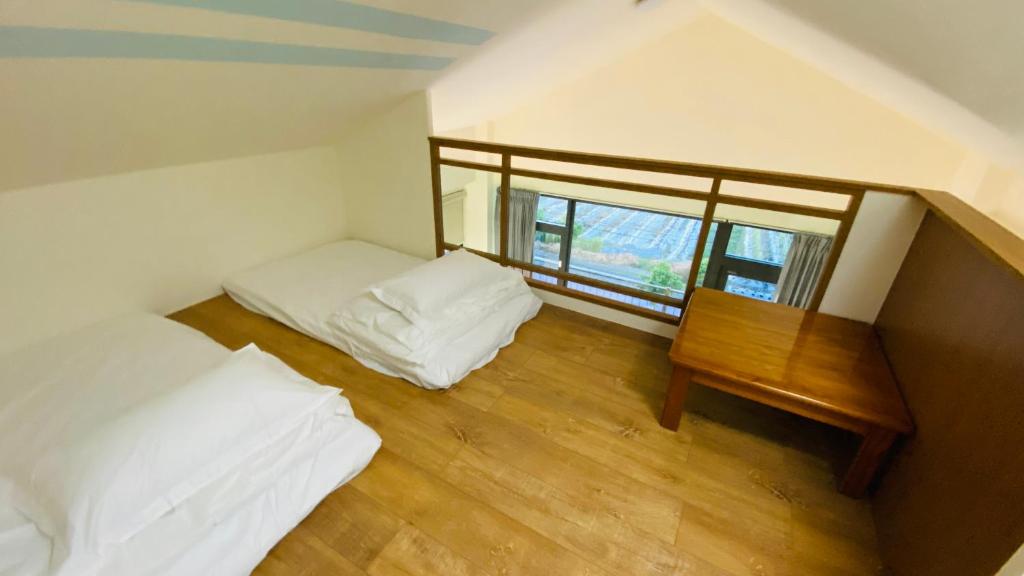 Voodi või voodid majutusasutuse Fu Yu B&B toas