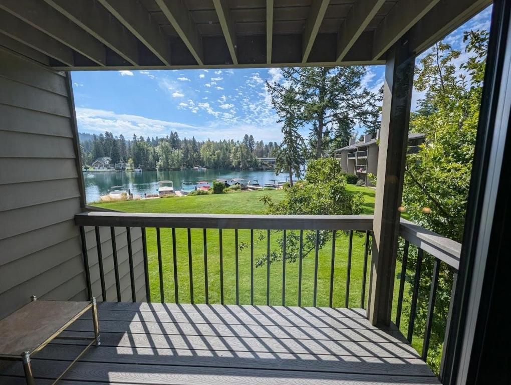 a balcony with a view of a lake at Bay View Luxury Studio in Bigfork
