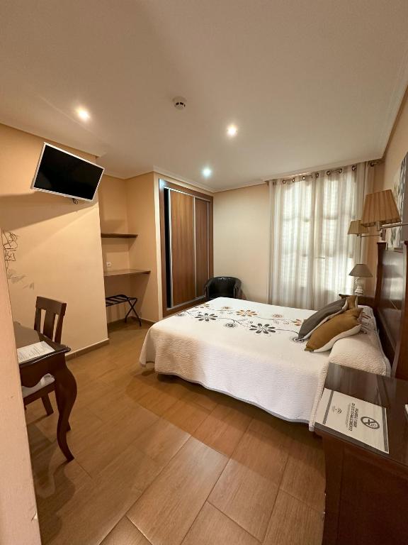 Postel nebo postele na pokoji v ubytování Hostal Avenida
