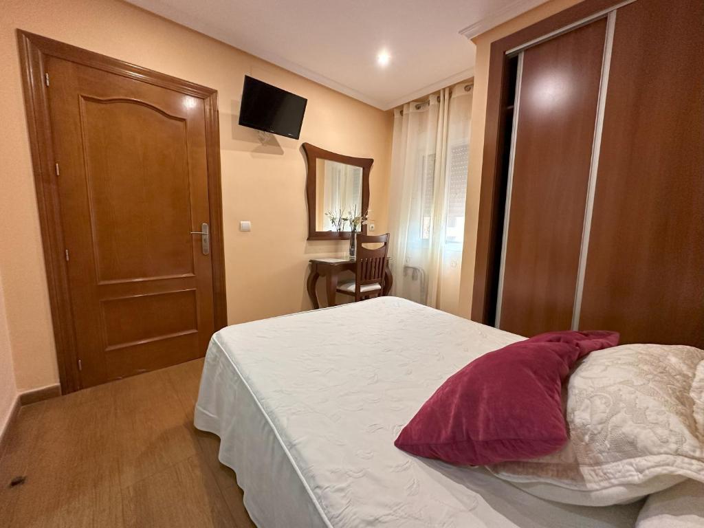 Postel nebo postele na pokoji v ubytování Hostal Avenida