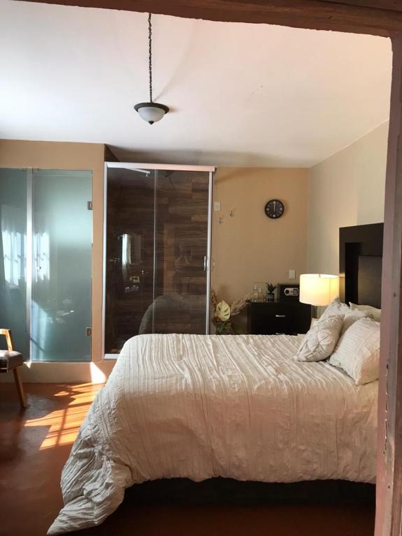 Postel nebo postele na pokoji v ubytování Casa de las Escaleras