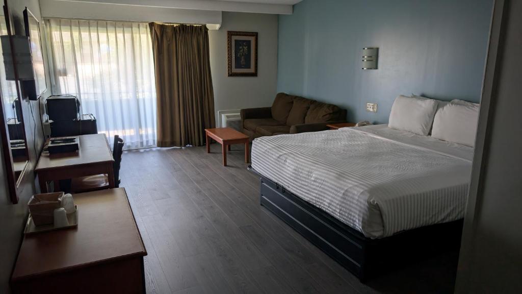 Postel nebo postele na pokoji v ubytování Crystal Inn - Neptune