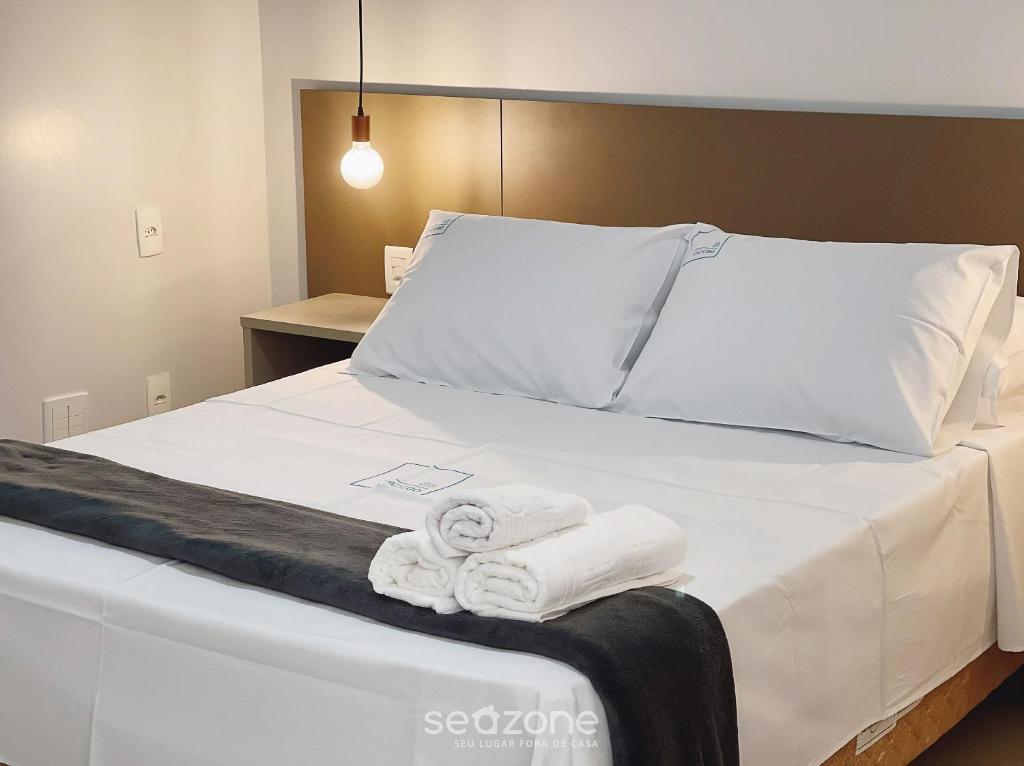Postel nebo postele na pokoji v ubytování Onix Bueno Residence - ONX