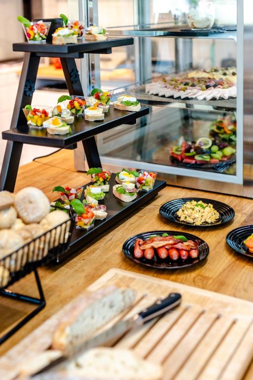 a buffet filled with different types of food on display at Hotel Active Stadium in Lovosice