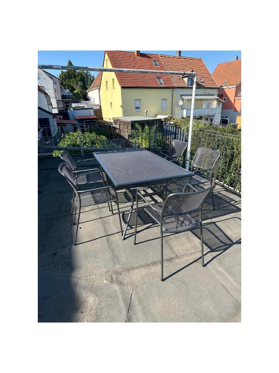 a table and chairs sitting on a patio at Anka´s Ferienhaus in Bexbach