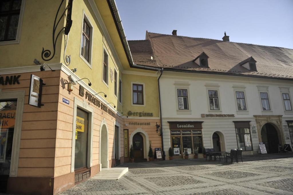 a group of buildings on a street at Casa Weidner in Sibiu