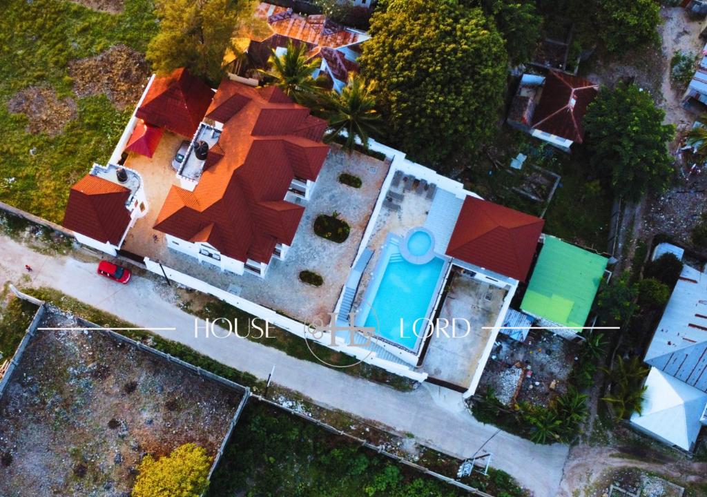 an aerial view of a house with a swimming pool at Villa Alpha in Gulioni
