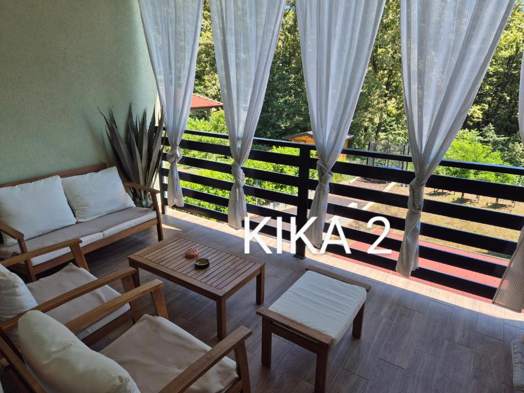a living room with a couch and a table at Kika apartmani-FREE PARKING- 7 km od centra in Zagreb
