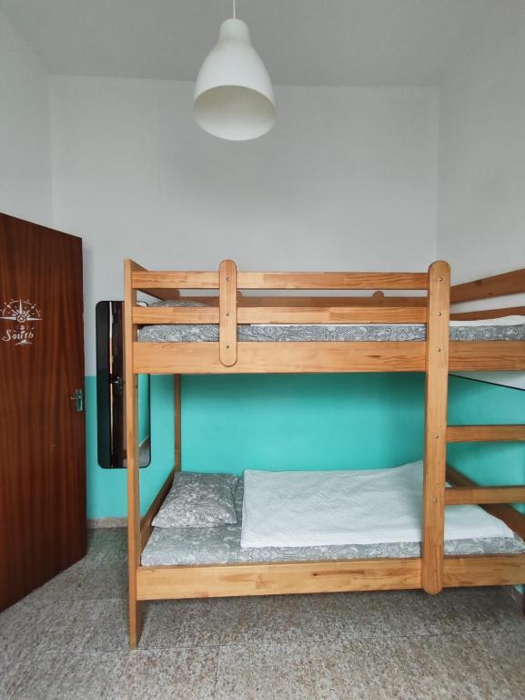 Postel nebo postele na pokoji v ubytování Hostel Vagamundo
