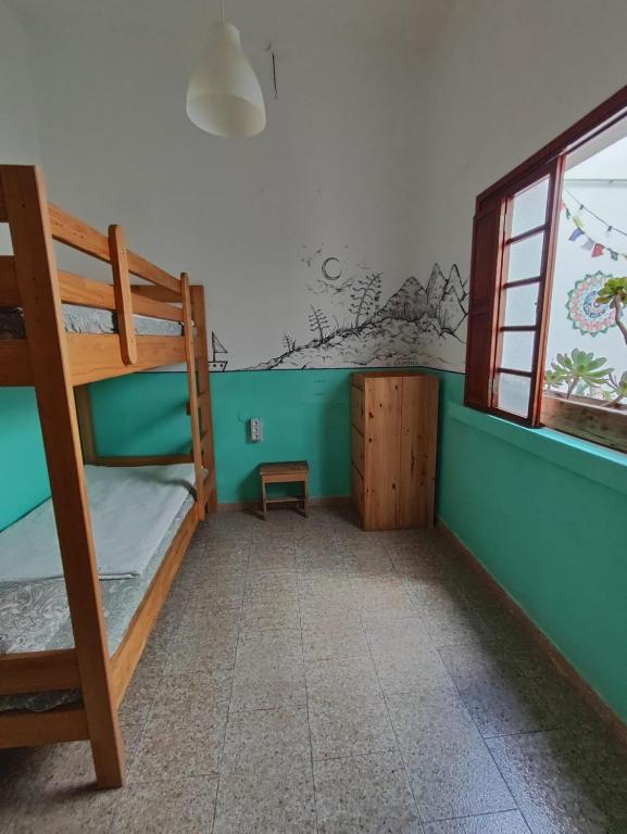 Postel nebo postele na pokoji v ubytování Hostel Vagamundo