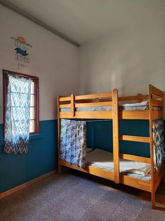 Postel nebo postele na pokoji v ubytování Hostel Vagamundo