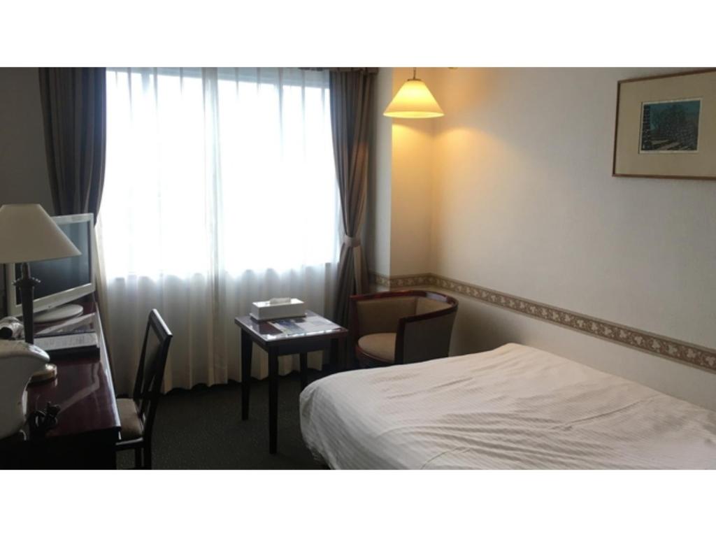 Giường trong phòng chung tại TSUYAMA KAKUZAN HOTEL - Vacation STAY 75683v