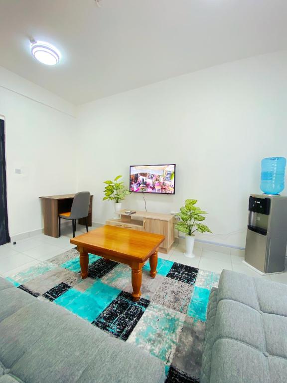 a living room with a coffee table and a couch at Bahari Three Bedroom Mombasa in Mombasa