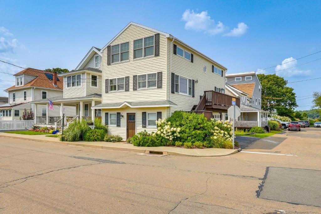 a large white house on the corner of a street at Walk to Beaches Sunny East Haven Home with Grill in West Haven