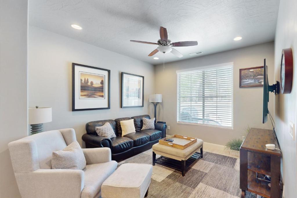a living room with a couch and a ceiling fan at Great Escape in Washington
