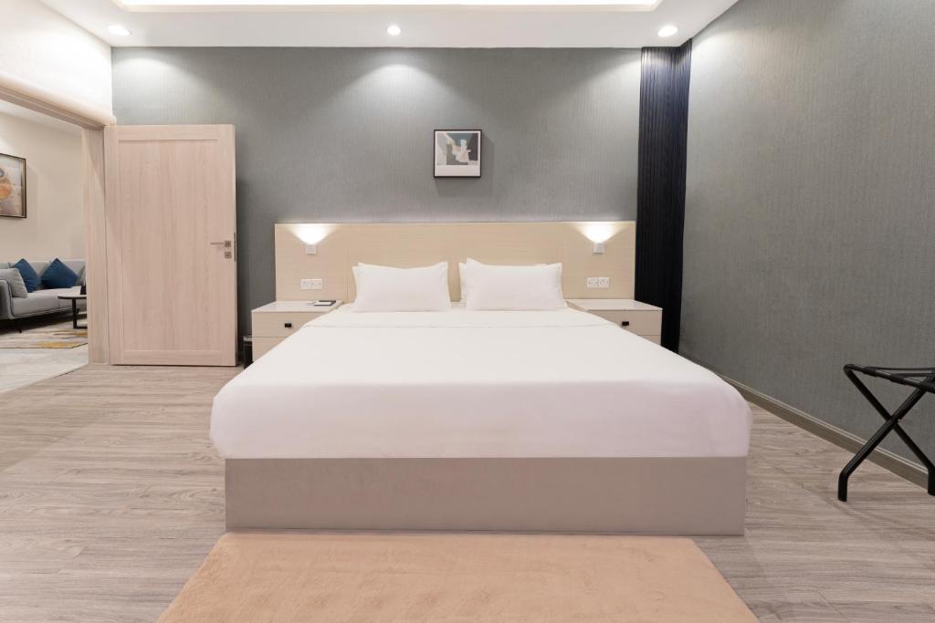 Postel nebo postele na pokoji v ubytování الكراني للشقق الفندقية - AlKrrani Serviced Apartments
