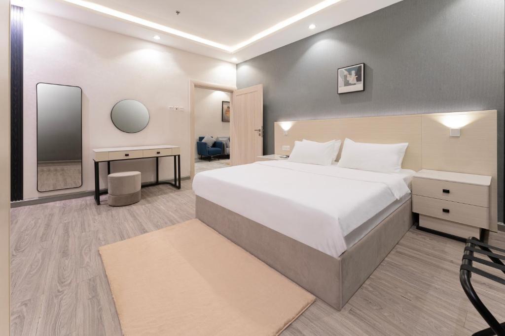 Postel nebo postele na pokoji v ubytování الكراني للشقق الفندقية - AlKrrani Serviced Apartments