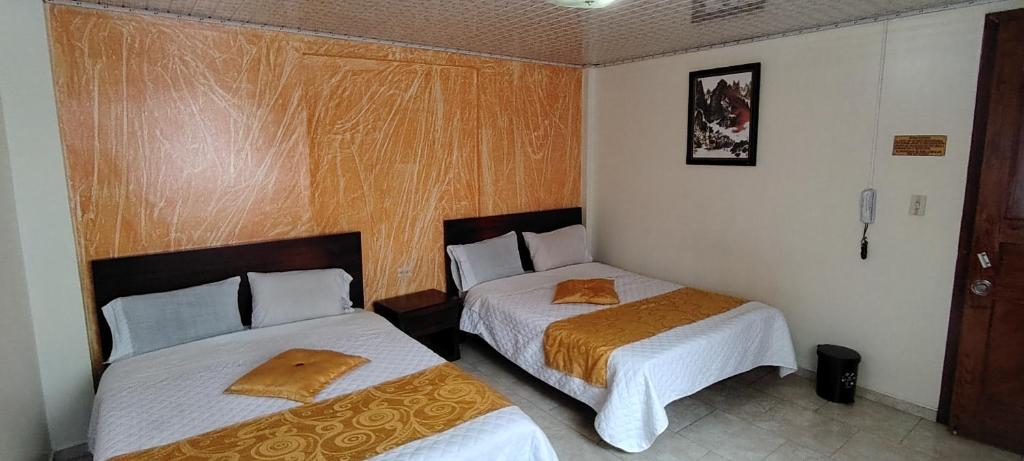 Postel nebo postele na pokoji v ubytování Hotel Gun Glub