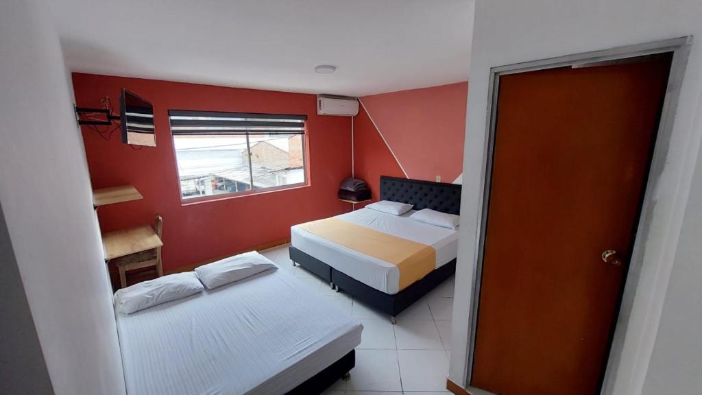 Postel nebo postele na pokoji v ubytování Hotel Picasso 70