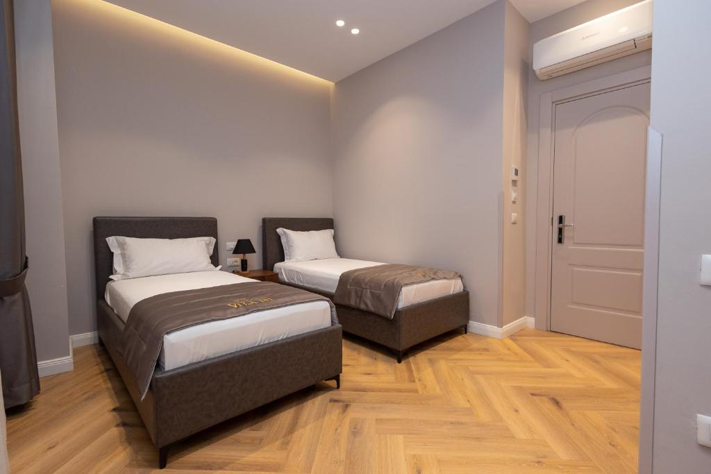 Postel nebo postele na pokoji v ubytování Boutique Hotel Vila 101