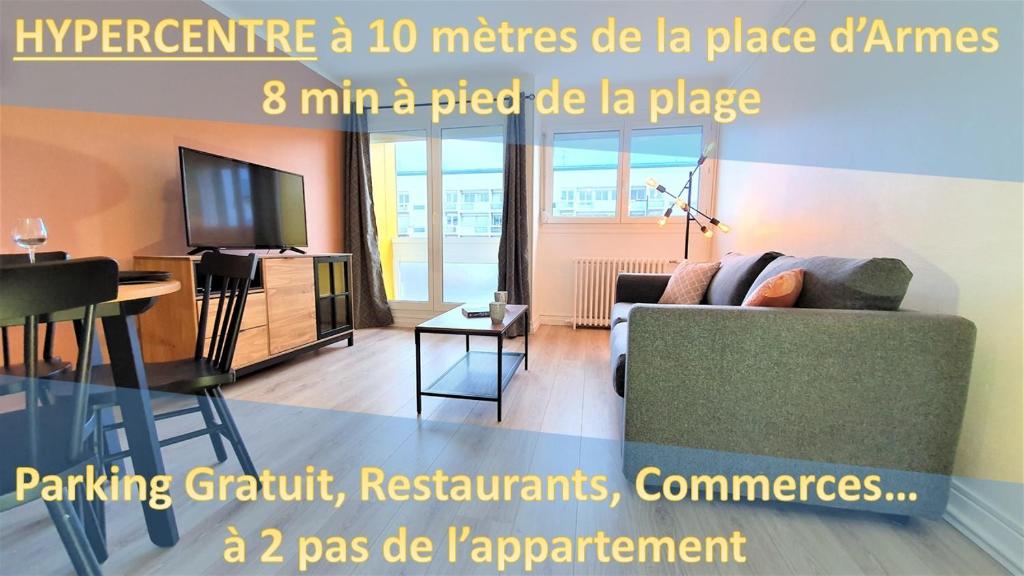 a living room with a couch and a tv at Tour du Guet 1 in Calais