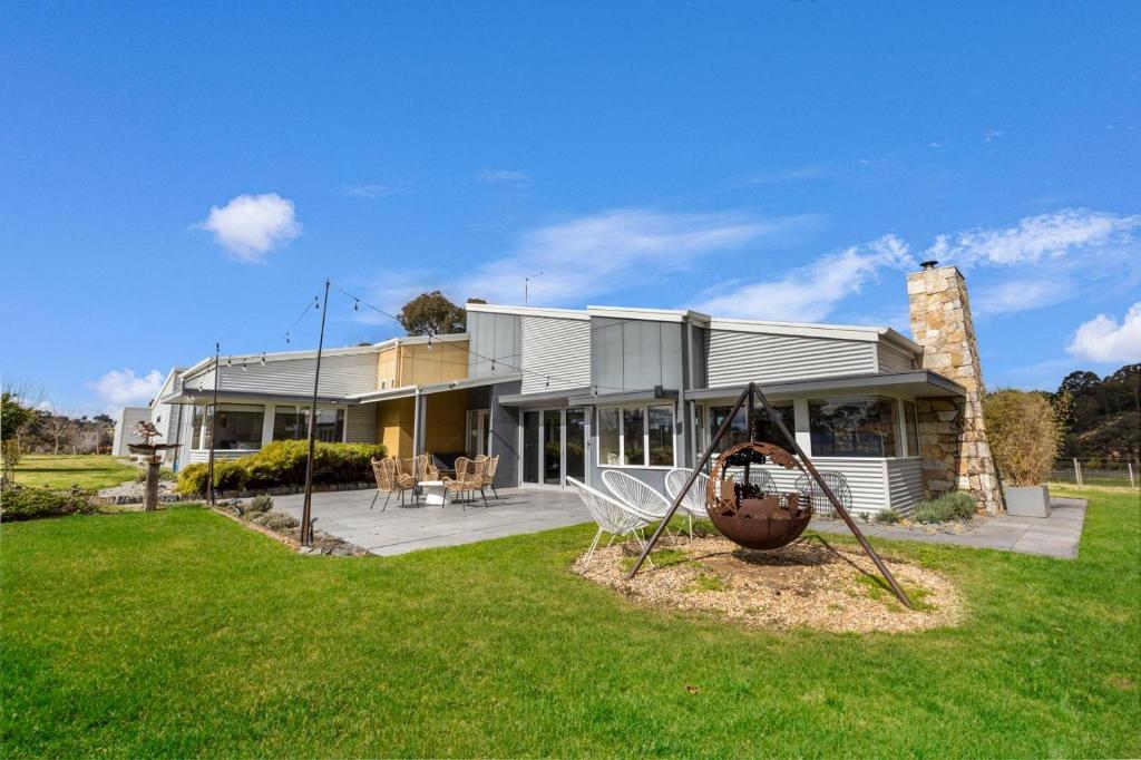 a house with a playground in front of it at Limestone Views in Swan Reach