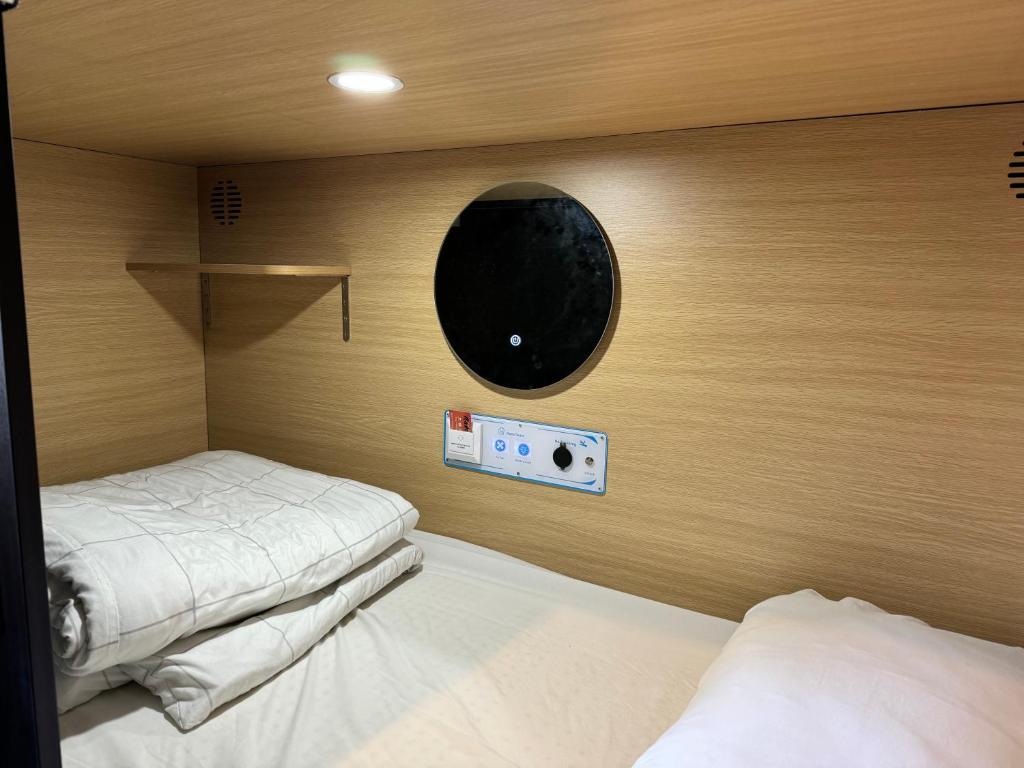 Postel nebo postele na pokoji v ubytování UpTown Backpackers
