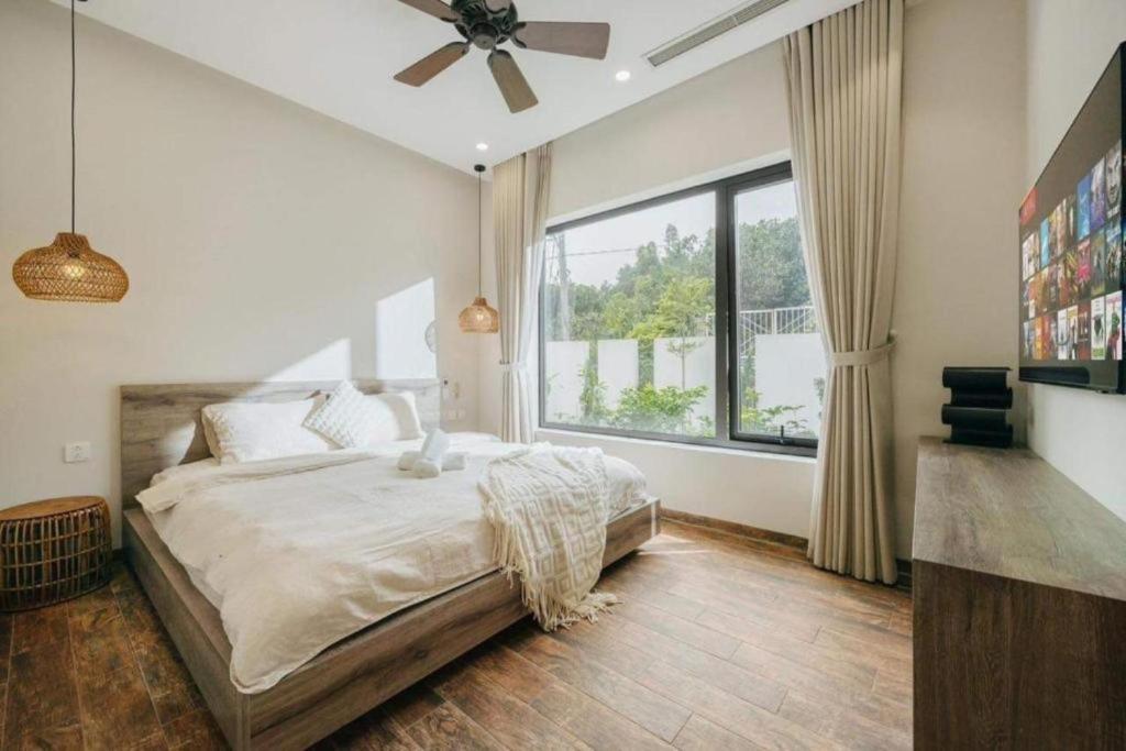 Postel nebo postele na pokoji v ubytování Velia Villa Venuestay