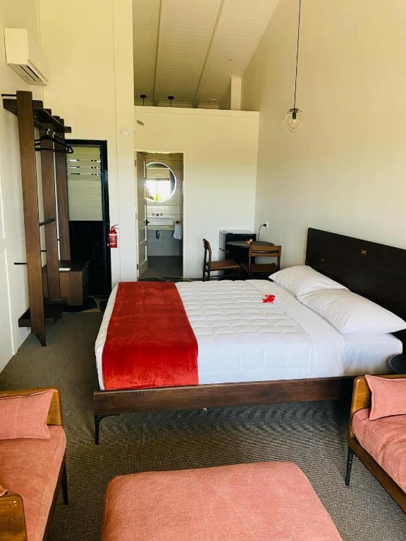 Postel nebo postele na pokoji v ubytování The Kongakava Hotel
