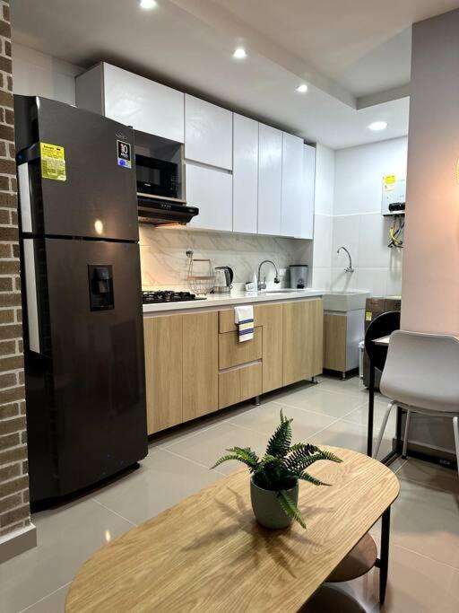 Kuchyň nebo kuchyňský kout v ubytování Hermoso Apartamento Entero