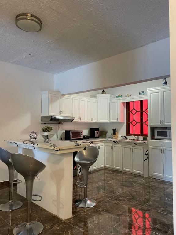 Kuchyň nebo kuchyňský kout v ubytování Casa Jacaranda