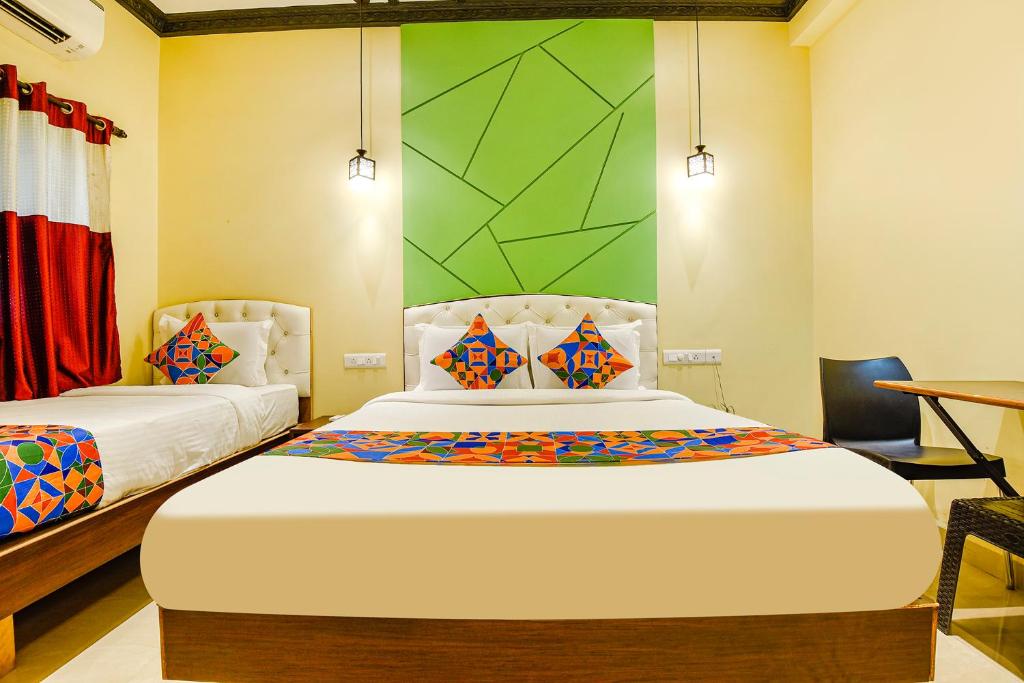 Postel nebo postele na pokoji v ubytování FabHotel Prime Swarnam, Old Goa