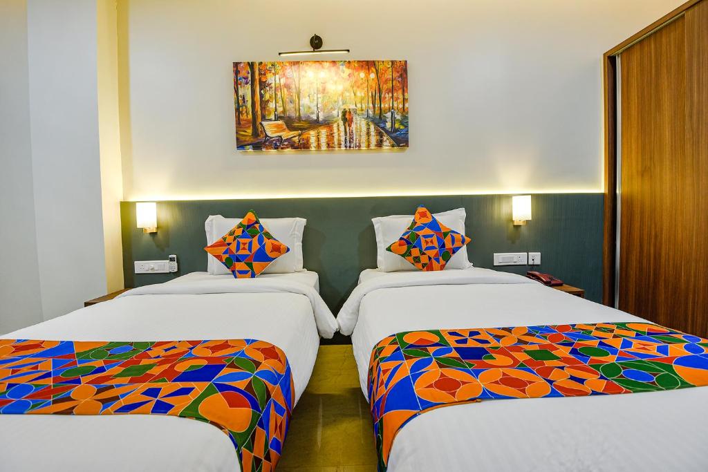 Postel nebo postele na pokoji v ubytování FabHotel Prime Swarnam, Old Goa