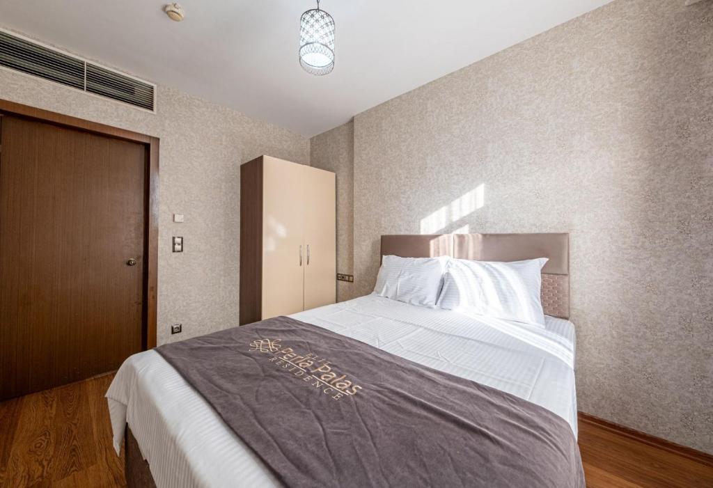 Postel nebo postele na pokoji v ubytování ELİT SUİT