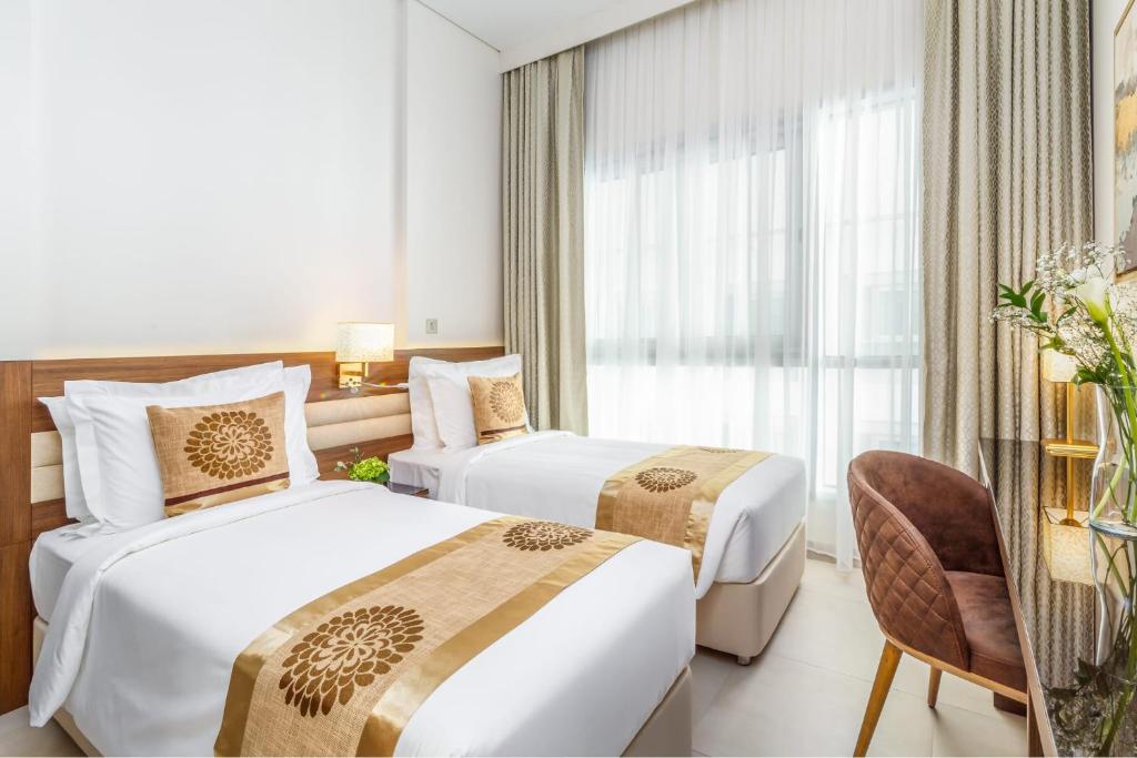 Postel nebo postele na pokoji v ubytování Central Inn Hotel & Suites - Al Sadd, Doha, Qatar