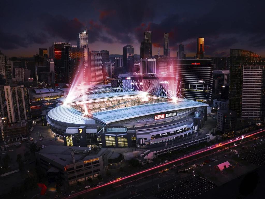a view of a stadium at night with a city at A 2BR Apt with Harbour Views and FREE Parking in Melbourne
