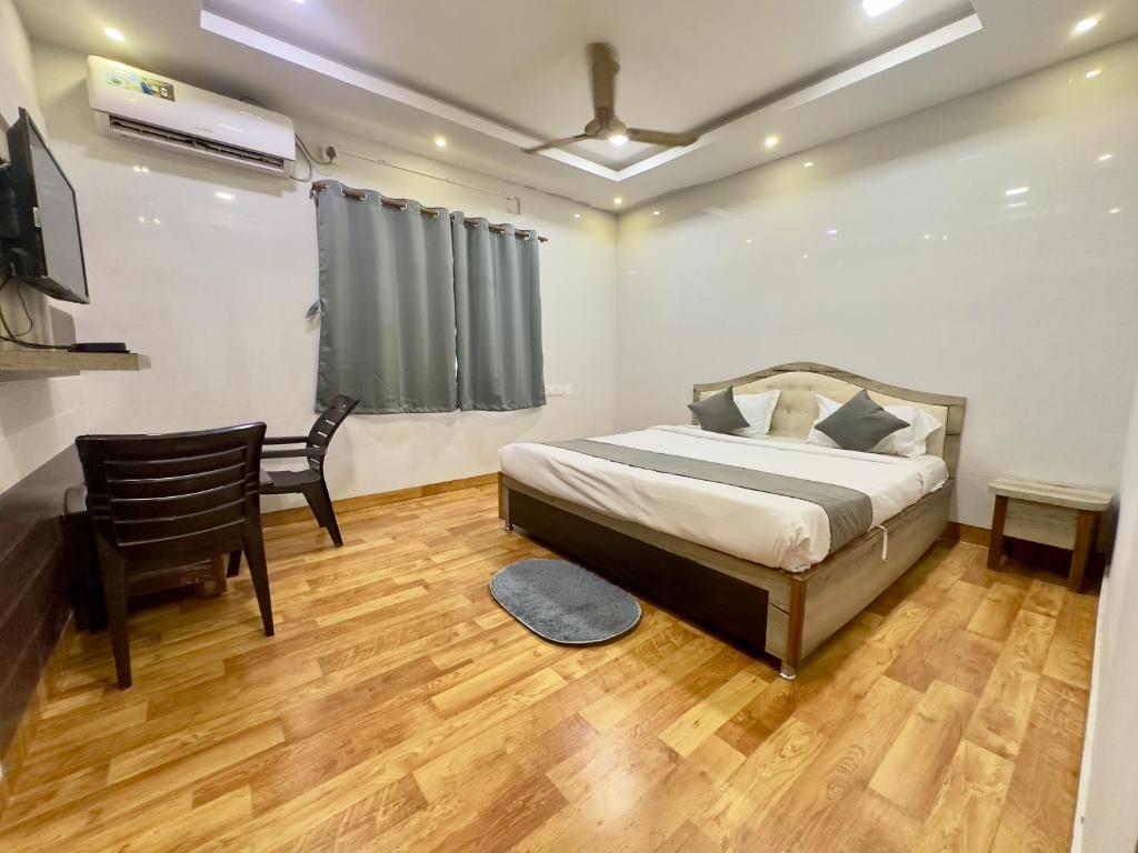 Postel nebo postele na pokoji v ubytování Hi5 Hotel Aryan