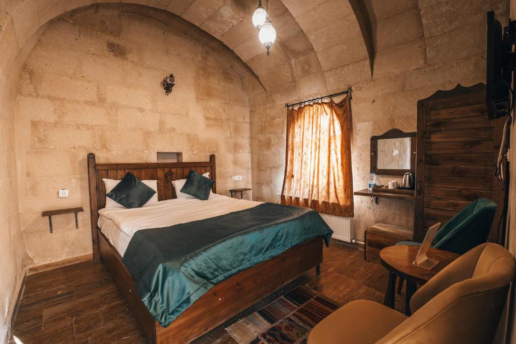 Postel nebo postele na pokoji v ubytování Sierra Cave Göreme Cappadocia