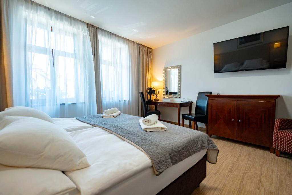 Postel nebo postele na pokoji v ubytování Hotel Volf