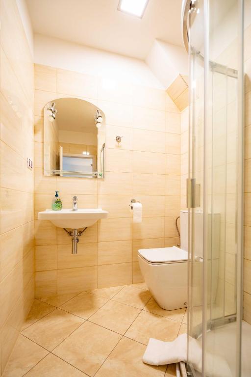 Koupelna v ubytování Hotel Volf